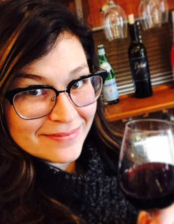 Person holding glass of Blackbird Wine